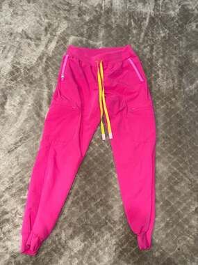 FIGS Zamunda Jogger Scrub Pants in Shocking Pink with Neon Yellow Drawstring